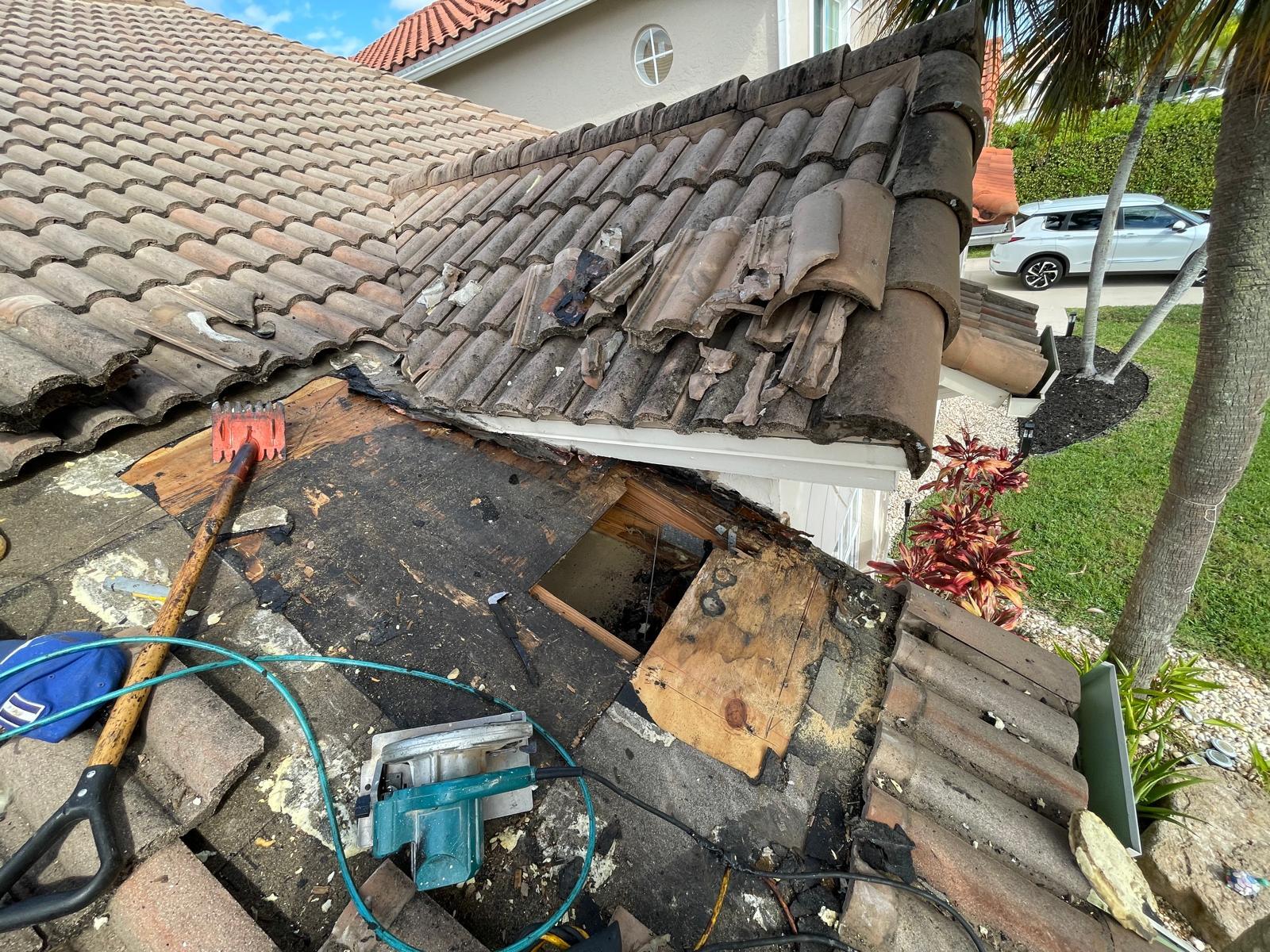 Open decking during tile roof repair in Boca Raton, FL