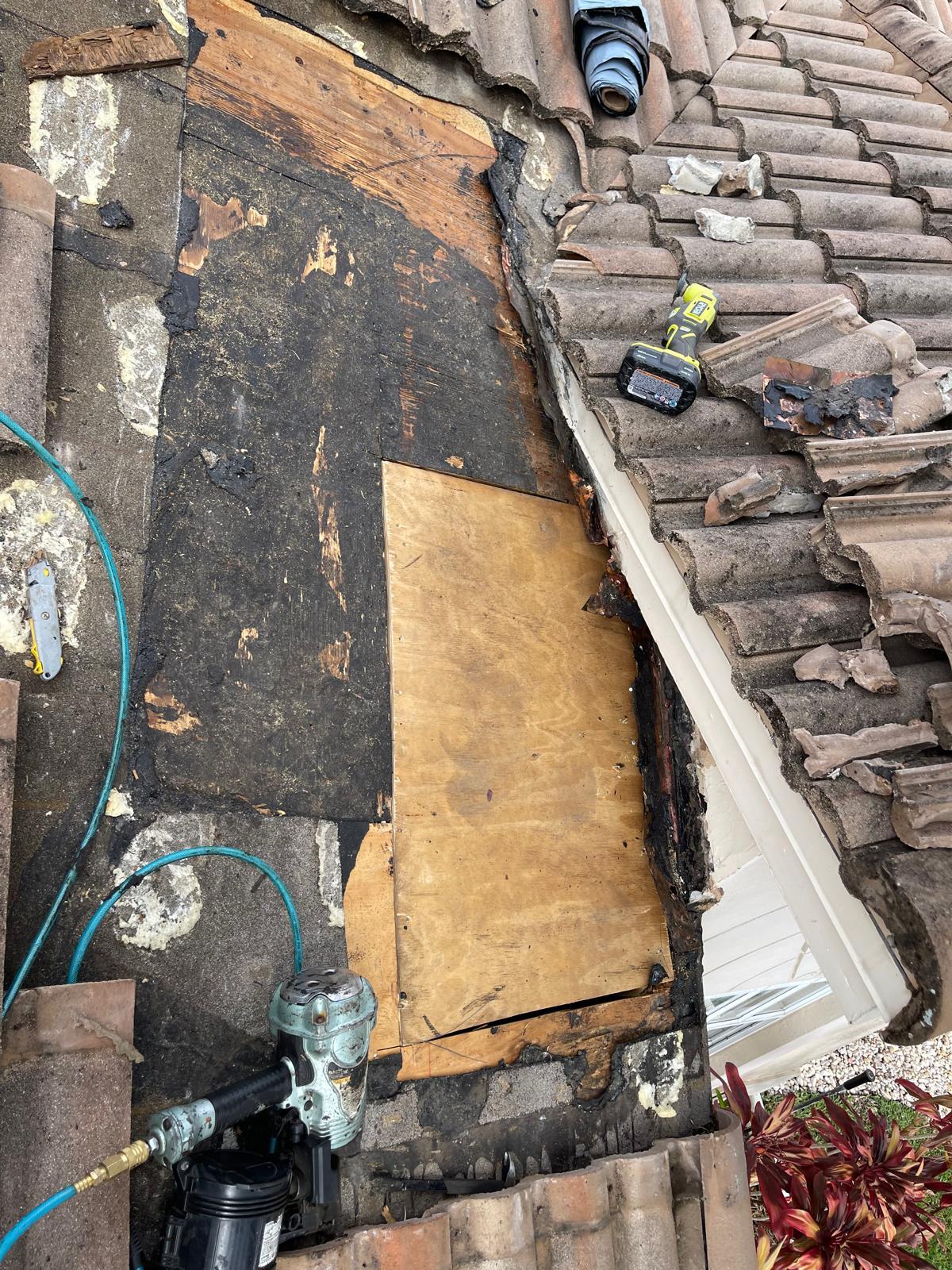 Broken tiles removed during roof repair in Boca Raton, FL