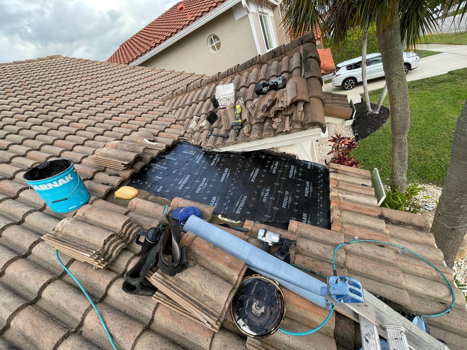 Renegade Roofing Co. tools on site for tile roof repair in Boca Raton, FL