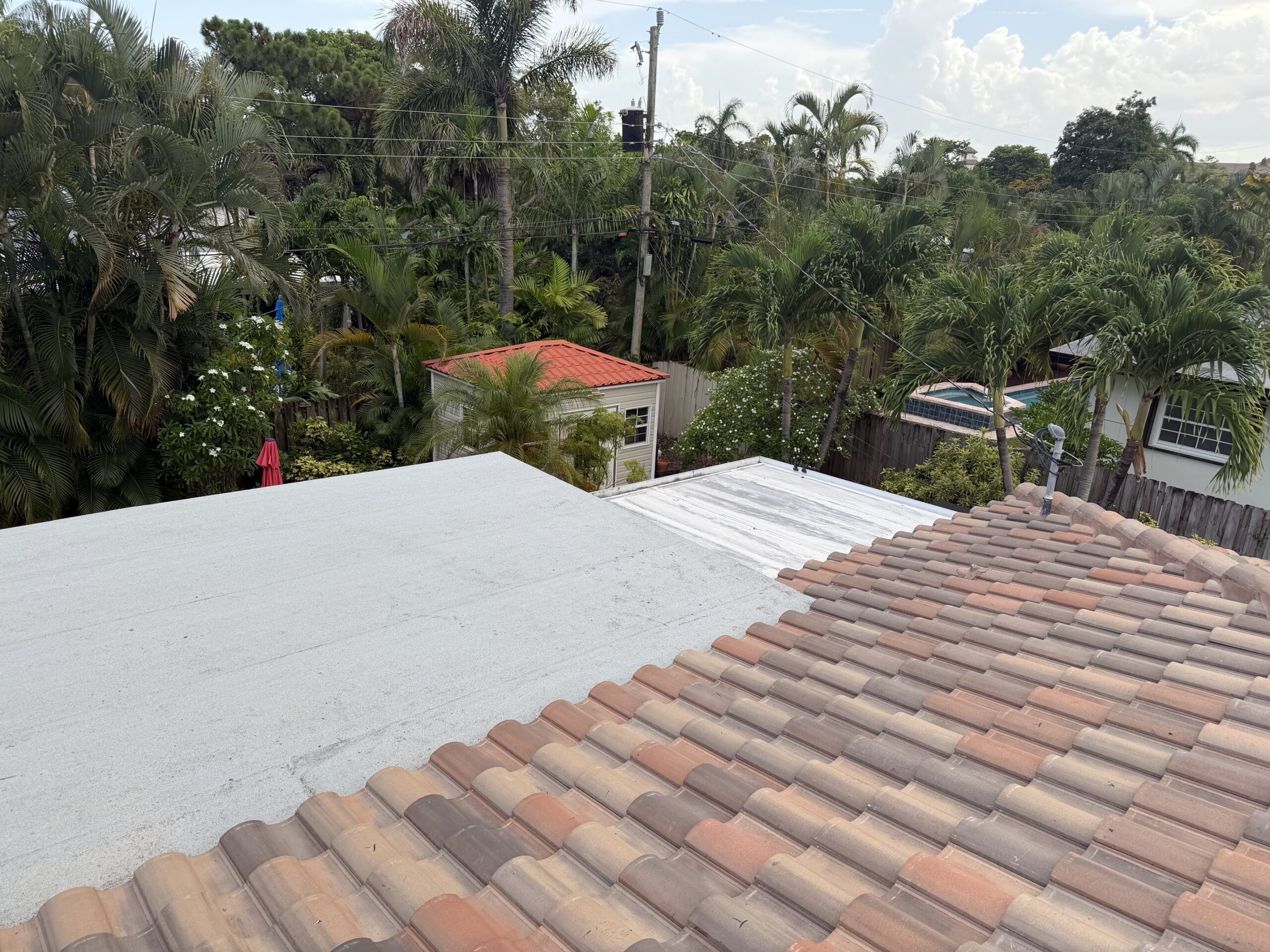 Close-up of tile and flat roof transition in Wilton Manors, FL